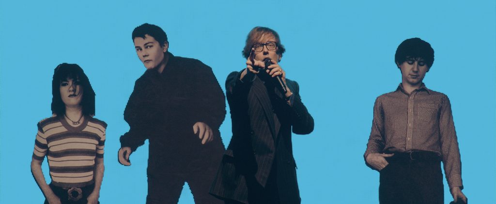 Jarvis Cocker pointing on stage.